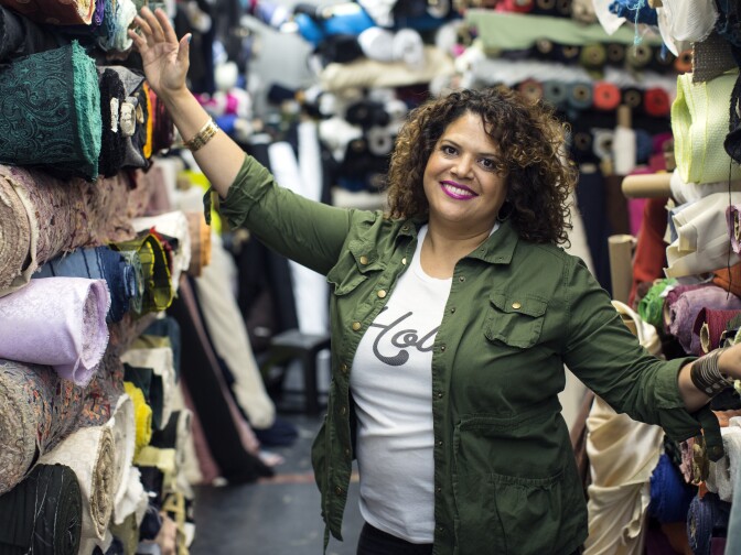 Sonia Kang stands inside Rag Finders of California, the wholesale fabric store where she sources her materials.