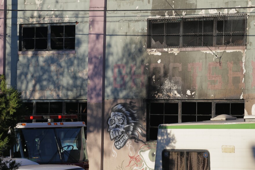 OAKLAND, CA - DECEMBER 03:  Charred windows on the face of a building that was the scene of a overnight fire that claimed the lives of at least nine people at a warehouse in the Fruitvale neighborhood on December 3, 2016 in Oakland, California. The warehouse was hosting an electronic music party.  (Photo by Elijah Nouvelage/Getty Images)