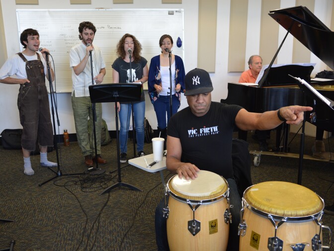 The CalArts Salsa Band singers in rehearsal. (L-R): Gabriel Stout, Pablo Leñero, Ewa Zmijewska and Tiffany Lantello. The ensemble is led by percussionist Joey de León and pianist David Roitstein.