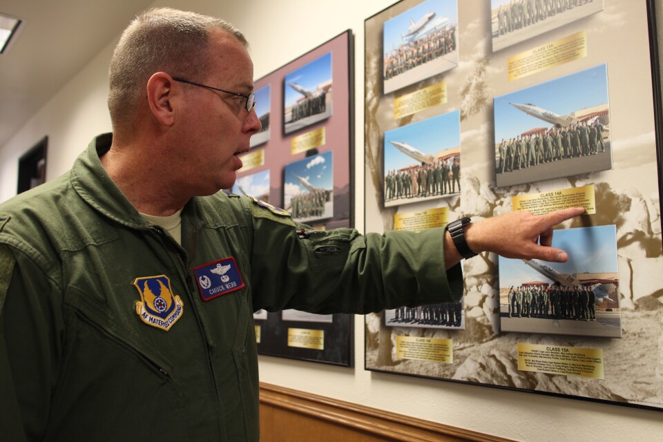 Colonel Charles Webb walks down the hallways lined with class photos dating back to the school’s founding in 1944. 