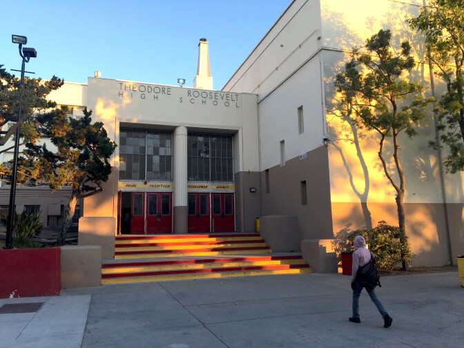 A student walks toward an entrance of the historic "R Building" on the campus of L.A. Unified's Roosevelt High School in Boyle Heights.