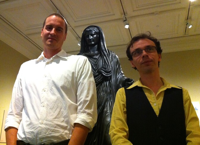(L-R) Conservator Erik Risser and curator David Saunders with the statue that stars in the new Getty Villa exhibit, "Tiberius: Portrait of an Emperor."