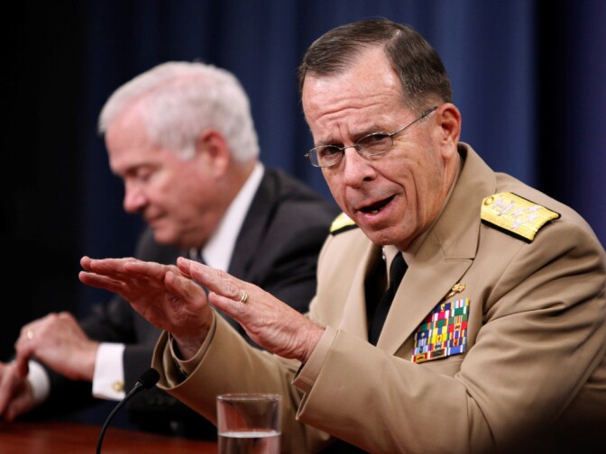 Adm. Mike Mullen (right), chairman of the Joint Chiefs of Staff, accompanied by Defense Secretary Robert Gates, attends a news conference at the Pentagon on June 18.