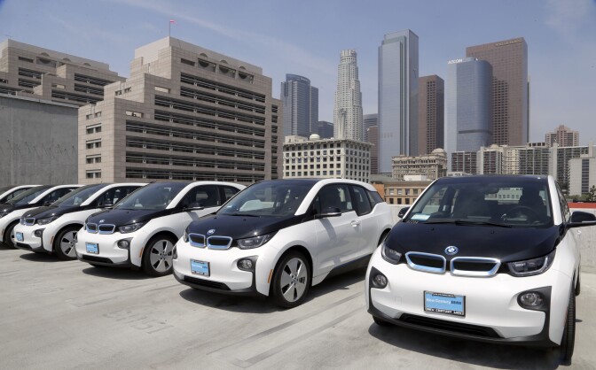 Electric cars are parked atop the Los Angeles Police Department parking lot, in Los Angeles on Wednesday, June 8, 2016. The Los Angeles Police Department has added 100 electric cars to its fleet as replacements for aging vehicles. The newly leased additions to the department motor pool announced Wednesday are BMW i3 models. The cars are not for regular police patrols. They will largely be used by the department's civilian work force and sometimes by officers. (AP Photo/Nick Ut)