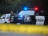 A police officer provides security near the parking lot of the Borderline Bar and Grill in Thousand Oaks, California on November 8, 2018. - A 28-year-old former US Marine opened fire in the country music bar packed with college students, killing 12 people including a police officer. Ventura County Sheriff Geoff Dean told a news conference the suspect had been identified as Ian David Long, a veteran of the US Marine Corps. (Photo by Frederic J. BROWN / AFP)        (Photo credit should read FREDERIC J. BROWN/AFP/Getty Images)