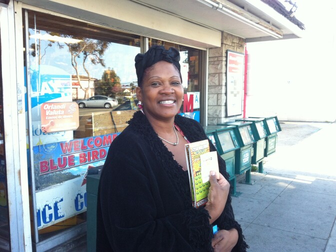 Andrea Harris of Compton stood in line twice to buy Powerball lottery tickets Monday at Bluebird Liquor Store in Hawthorne.