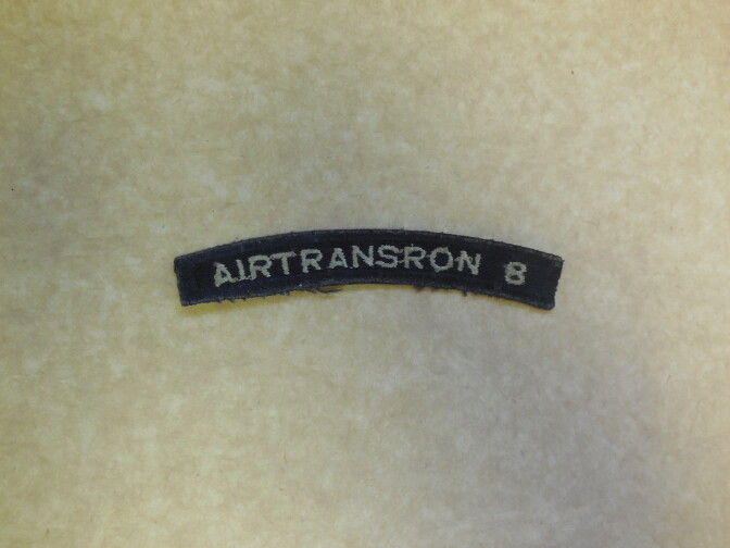 The unit patch, commonly called a "rocker," for Air Transportation Squadron 8 word by Fritz Frauchiger during his time in the U.S. Navy.
