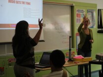 Teaching artists Deirdre Marlowe and Mina Bloom talk to students about the importance of using music that matches the tone of the lyrics. 