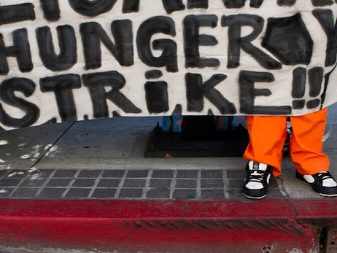 A banner at a protest in Downtown Los Angeles on Monday morning.