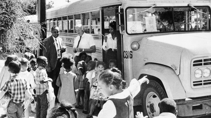 Youngsters head for a school bus in Berkeley, California on Feb. 24, 1970, where a busing program tomix black and white youngsters has been working for 18 months with apparent decline in opposition in this hometown of Black Panther leaders Bobb Seale and Huey P. Newton. Superintendent of schools, Dr. Richard L. Foster says a survey before busing indicated a 50 per cent opposition to the program, but most recent estimates are only 30 per cent. (AP Photo/RWK)
