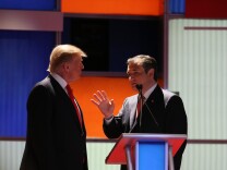 NORTH CHARLESTON, SC - JANUARY 14:  Republican presidential candidates (L-R) Donald Trump and Sen. Ted Cruz (R-TX) speak during a commercial break in the Fox Business Network Republican presidential debate at the North Charleston Coliseum and Performing Arts Center on January 14, 2016 in North Charleston, South Carolina. The sixth Republican debate is held in two parts, one main debate for the top seven candidates, and another for three other candidates lower in the current polls.  (Photo by Scott Olson/Getty Images)