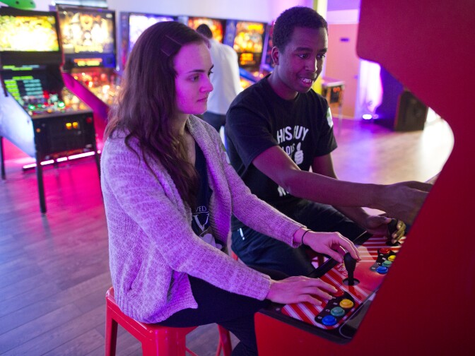 Nicole and husband Blake Bolton play Wind Jammers at Neon Retro Arcade in Pasadena. The couple walked past the space, looked it up online and decided to go for the first time on Wednesday, Feb. 4.