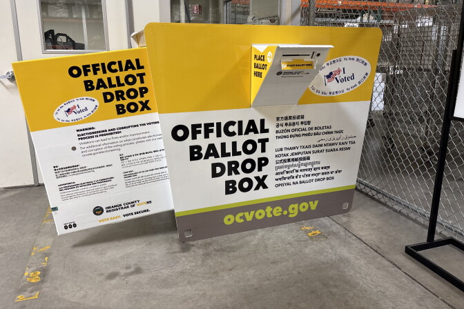 A look at a large steel bin that is the official ballot drop box for Orange County: On the side and door is language explaining how the box works, along with directions to a website to help with more information: OCVote.gov