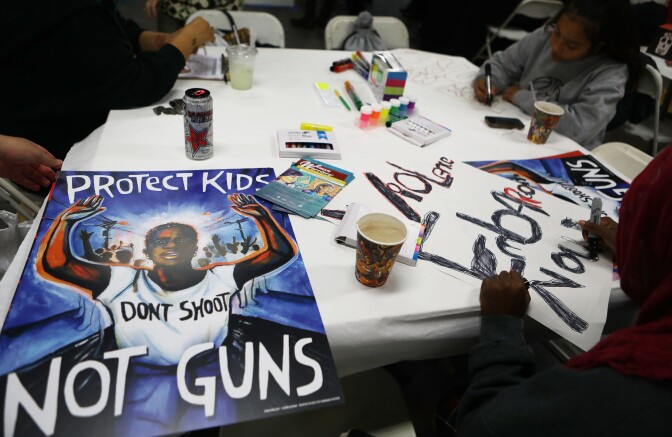 In this March 22 photo, young activists in Los Angeles paint signs to be carried at the upcoming March for Our Lives Los Angeles. More than 500,000 are expected to march for gun control at rallies nationwide on March 24.
