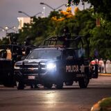 EDITORS NOTE: Graphic content / Mexican police patrol in a street of Culiacan, state of Sinaloa, Mexico, on October 17, 2019, after heavily armed gunmen in four-by-four trucks fought an intense battle with Mexican security forces. - Mexican security forces on Thursday arrested one son of jailed drug kingpin Joaquin "El Chapo" Guzman in an operation that triggered fighting in the western city of Culiacan, Security Minister Alfonso Durazo said. (Photo by RASHIDE FRIAS / AFP) (Photo by RASHIDE FRIAS/AFP via Getty Images)