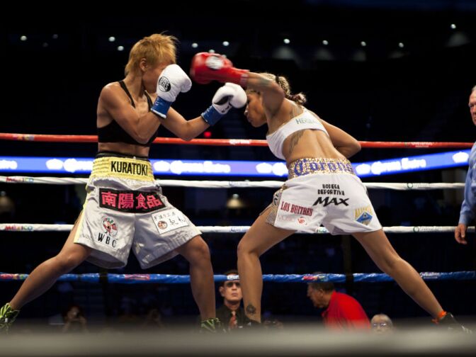Round 1: Fists are up and the boxing match begins between the Mexican fighter "La Barbie" v. her Japanese opponent, Shindo Go.