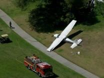 A single-engine Cessna lands at Westlake Golf Course on Monday, April 29, 2013.
