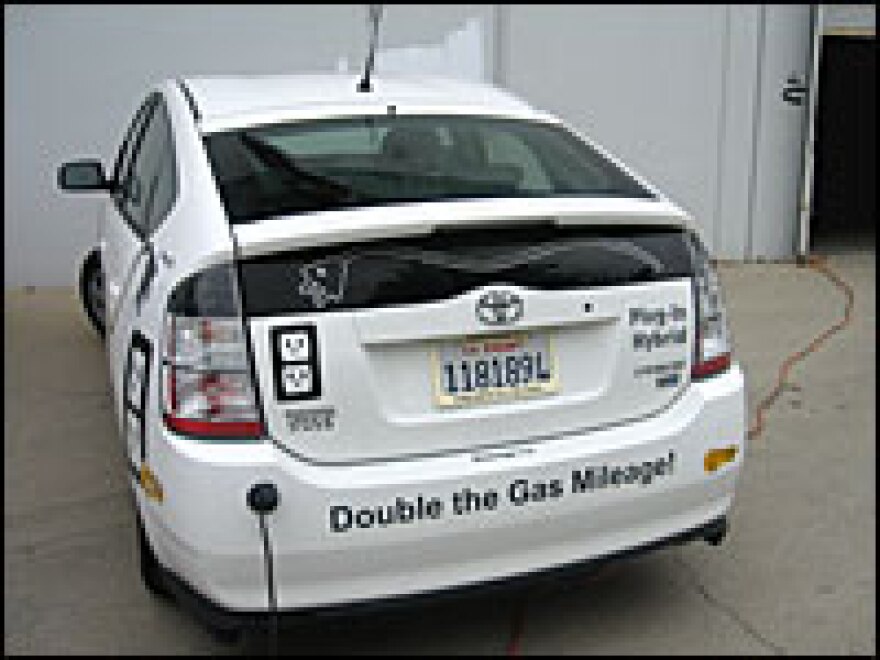 Peter Nortman's engineering company is converting a Prius hybrid, which normally gets about 50 miles per gallon, into a plug-in car that runs the majority of the time on electricity.