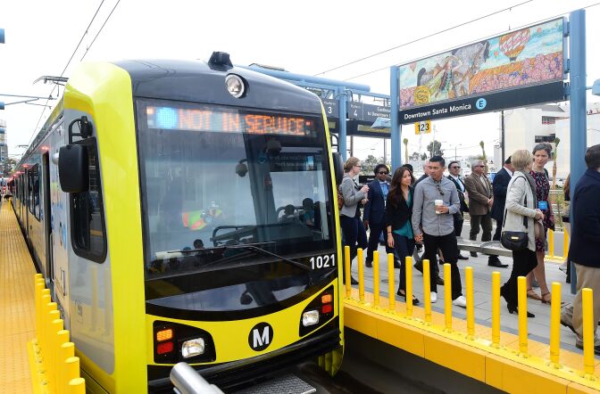People make their way across the platform following the arrival of city, county officials and passengers on the first train in 53 years to arrive at Santa Monica station in Santa Monica, California on May 20, 2016.  
The  USD 1.5 billion extension connects the Expo Line from its current end location near Venice and Robertson boulevards to downtown Santa Monica.  / AFP / FREDERIC J. BROWN        (Photo credit should read FREDERIC J. BROWN/AFP/Getty Images)