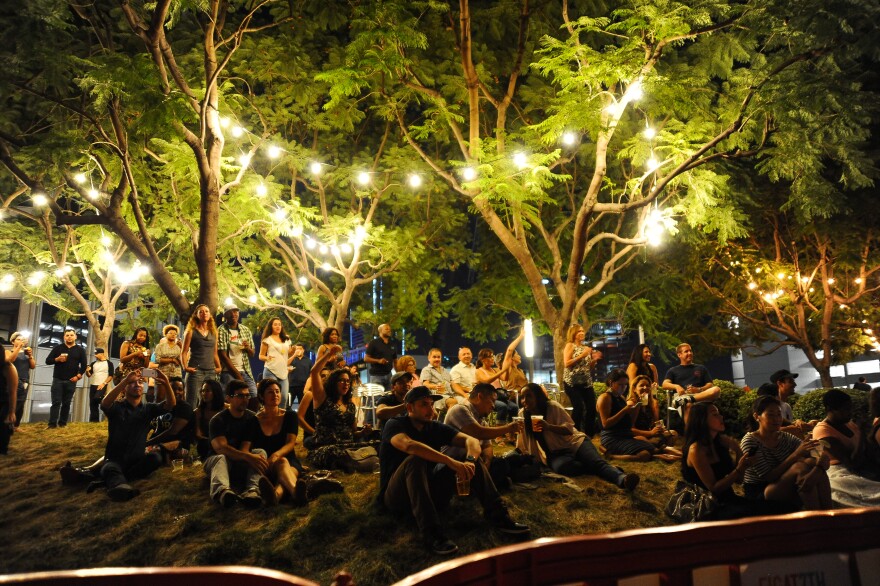 Fans listen to a performance of Afro Brazilian music at a free concert at FIGat7th in 2015.