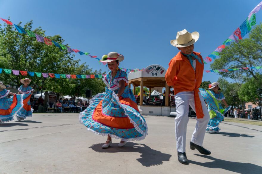 Ballet Folklorico dancers perform in a plaza