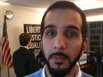 Ali Malik, at a news conference, is one of three plaintiffs named in a lawsuit against the FBI.