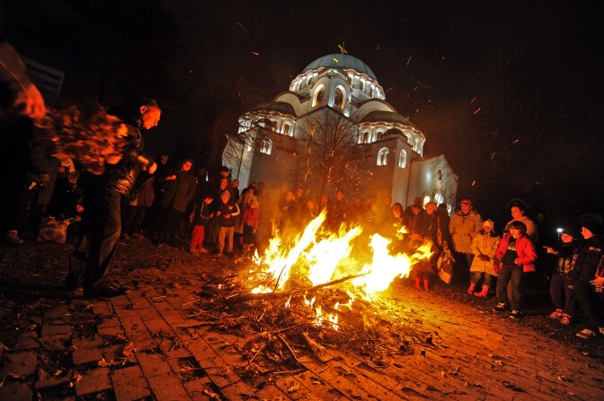 Serbs burn oak branches during Christmas Eve in front of the Saint Sava church in Belgrade, on January 6, 2012.