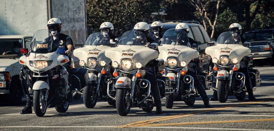 LAPD officers took to City Hall Tuesday to call for raises. The unionized officers rejected a deal earlier this month that would have provided money for overtime but which did not include any funds for raises.
