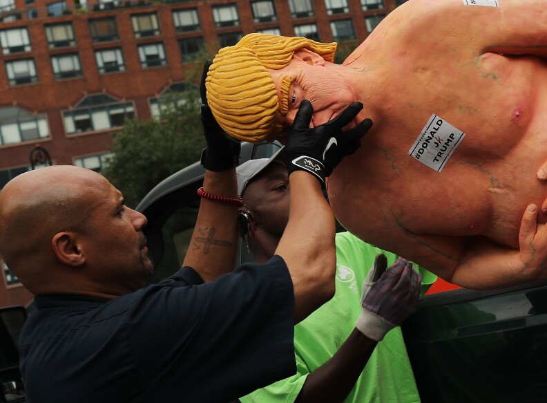 AUGUST 18:  A statue depicting republican presidential nominee Donald Trump in the nude is removed from New York City. Anarchist collective INDECLINE has created five statues and placed them in five U.S. cities: San Francisco, New York, Los Angeles, Cleveland and Seattle.