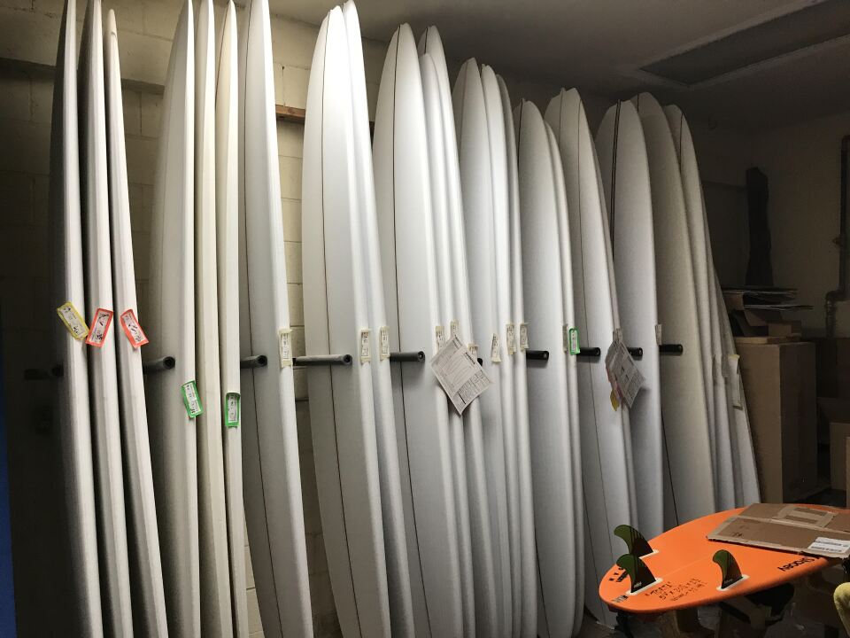 Harbour's workshop has dozens of surfboards in various states of completion.