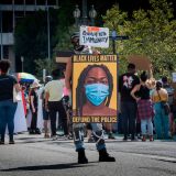 People protest against the death of George Floyd and others in police custody, as they support the Black Lives Matter movement outside the Hall of Justice in Los Angeles, California on June 24, 2020. (Photo by Mark RALSTON / AFP) (Photo by MARK RALSTON/AFP via Getty Images)