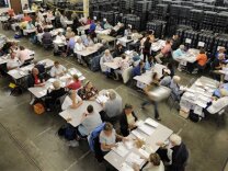 Workers sorts mailed in ballots at the County of Orange Registrar of Voters in Santa Ana, Calif., Tuesday, Oct. 28, 2008.