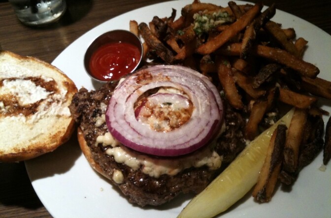 A Hamburger Hamlet burger with blue cheese, horseradish, A1 sauce, red onions and garlic fries.