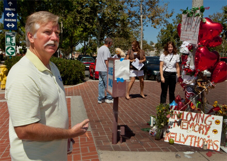 Ron Thomas, the father of victim, Kelly Thomas, stands next to a memorial for his son on Wednesday, Aug. 3, 2011, at the Fullerton Transportation Center in Fullerton, Calif. The parents of Kelly Thomas, a homeless man have demanded the release of a 911 tape and possible surveillance video from a California city, hoping the material will shed more light on what led to a physical altercation last month between police officers and their son, who later died. 