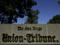 SAN DIEGO, CA - MARCH 18:  A sign sits on display at the front entrance to the offices of the San Diego Union-Tribune newspaper on March 18, 2009 in San Diego, California. The Copley Press Inc. announced today that they have signed a definitive agreement to sell the Union-Tribune to private equity firm Platinum Equity.  (Photo by Sandy Huffaker/Getty Images)