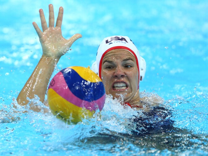 LONDON, ENGLAND - AUGUST 09:  Kami Craig #12 of United States gathers the ball in the Women's Water Polo Gold Medal match between the United States and Spain on Day 13 of the London 2012 Olympic Games at the Water Polo Arena on August 9, 2012 in London, England.  (Photo by Paul Gilham/Getty Images)