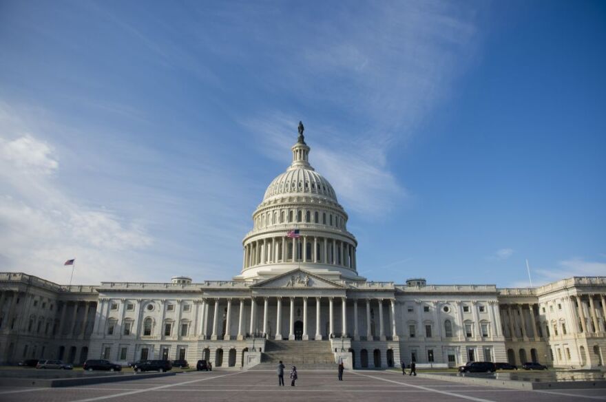 The U.S. Capitol in Washington, DC, on January 2, 2013, on the day after a compromise bill passed the U.S. Congress, avoiding the 'fiscal cliff.' The agreement raises taxes on the rich and puts off automatic $109 billion federal budget cuts for two months.