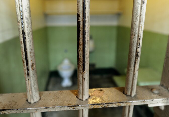 The worn bars in the cell block are seen at Alcatraz Island, a 22-acre rocky outcrop situated 1.5 miles offshore in San Francisco Bay, August 11, 2011.  Seventy-seven years ago on August 11, 1934, a group of federal prisoners classified as "most dangerous" arrived at the new high-security penitentiary designed to hold the most dangerous prisoners in the US penal system, especially those with a penchant for escape attempts. In r 20, 1969, a group of Native Americans called United Indians of All Tribes, mostly college students from San Francisco, occupied the island to protest federal policies related to American Indians.   During the 29 years it was in use, the jail held such notable criminals as Al Capone, Robert Franklin Stroud (the Birdman of Alcatraz), George "Machine Gun" Kelly, James "Whitey" Bulger, Bumpy Johnson, Rafael Cancel Miranda, member of the Puerto Rican Nationalist Party who attacked the United States Capitol building in 1954, Mickey Cohen, Arthur R. "Doc" Barker and Alvin Karpis (who served more time at Alcatraz than any other inmate).  Today, the island's facilities are operated by the National Park Service as part of the Golden Gate National Recreation Area; it is open to tours.   AFP PHOTO / TIMOTHY A. CLARY (Photo credit should read TIMOTHY A. CLARY/AFP/Getty Images)