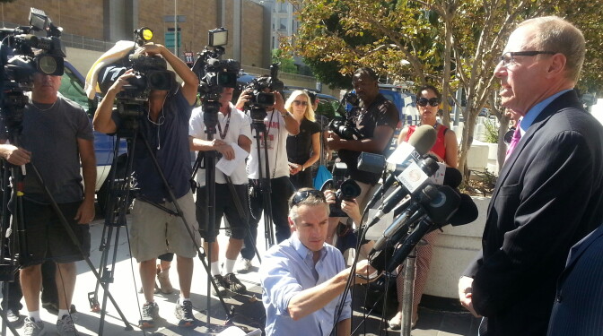 Attorney Steven Lerman talks to reporters outside the federal courthouse in downtown Los Angeles after filing a federal civil rights suit over the death of 25-year-old Ezell Ford. 