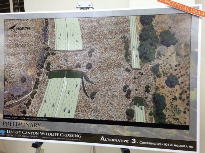 A poster shows an artist's rendering of Alternative 3, which would put a bridge over both the 101-Freeway and Agoura Road.