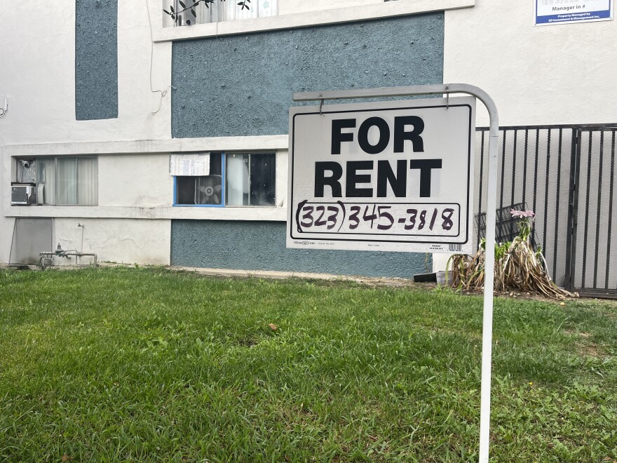 A "for rent" sign hangs outside a Los Angeles apartment building. 