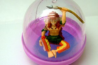 Wikipedia says gashapon is an onomatopoeia: "gacha for the turning of a crank on a toy vending machine, and pon for the sound of the toy capsule dropping into the receptacle." (Credit: John Rabe)