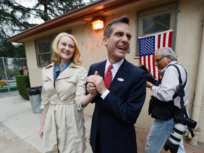 Candidate in the Los Angeles City mayoral race, Councilman Eric Garcetti and his wife Amy Wakeland leave a polling place after they voted at Allesandro Elementary School on March 5, 2013 in the Boyle Heights area of Los Angeles.