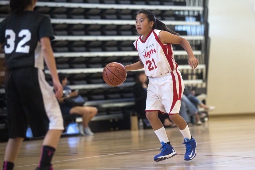 Hollywood Dodgers Shooting Star Maile Nakaji plays point guard during the first of three games at the West Los Angeles Youth Club's Invitational Basketball Tournament at Rancho Dominguez Preparatory School in Long Beach on Saturday morning, April 16, 2016.