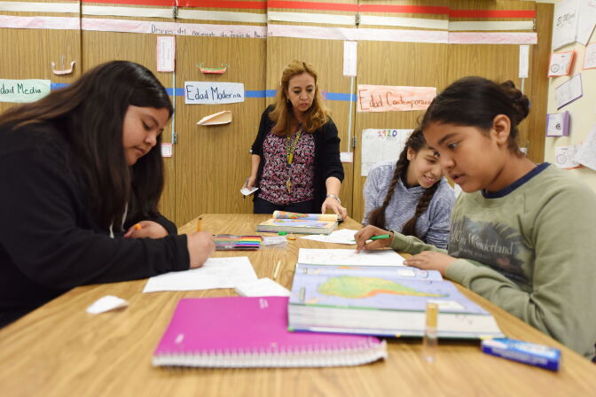 Instructor Blanca Claudio (C) teaches a history lesson in Spanish in a Dual Language Academy class at Franklin High School in Los Angeles, California, on May 25, 2017. / AFP PHOTO / Robyn Beck        (Photo credit should read ROBYN BECK/AFP/Getty Images)