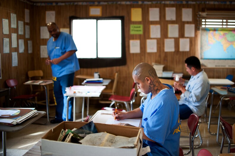 State prison inmates Earl Stewart, left, Ricardo Castillo and Jesus Ledesma take part in a painting class on Tuesday, Nov. 19 at Norco's California Rehabilitation Center.