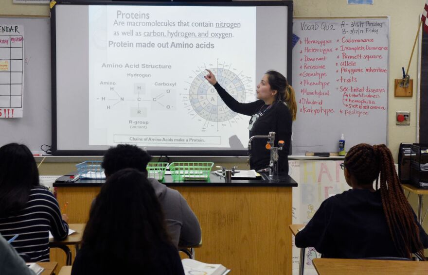 CORRECTION - Science teacher Virginia Escobar-Cheng works with her students in a science class in a high school in Homestead, Florida, on March 10, 2017. 
Texas state legislators are now considering a bill introduced in February that would offer teachers like Garlington some legal protection, by giving them latitude to present science "that may cause controversy" as a debatable theory. Texas is one of eight US states where such laws have been proposed since the beginning of the year. South Dakota, Oklahoma, Iowa, Alabama, Indiana, Florida and Arkansas are the others.
 / AFP PHOTO / RHONA WISE / The erroneous mention[s] appearing in the metadata of this photo by RHONA WISE has been modified in AFP systems in the following manner: [March 10, 2017 instead of [March 10, 2010]. Please immediately remove the erroneous mention[s] from all your online services and delete it (them) from your servers. If you have been authorized by AFP to distribute it (them) to third parties, please ensure that the same actions are carried out by them. Failure to promptly comply with these instructions will entail liability on your part for any continued or post notification usage. Therefore we thank you very much for all your attention and prompt action. We are sorry for the inconvenience this notification may cause and remain at your disposal for any further information you may require.        (Photo credit should read RHONA WISE/AFP/Getty Images)