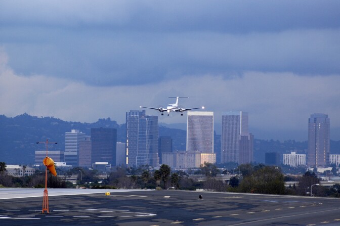 A plane flies into Santa Monica Airport. Santa Monica city council voted Thursday to shutter the airport for good in 2018.