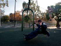 Fourth grader Daniel Fontes, center, enjoys a swing set that was part of a playground upgrade at Marguerita Elementary School. Voters approved the bond for the playground in 2008, and the bond was issued in 2010.