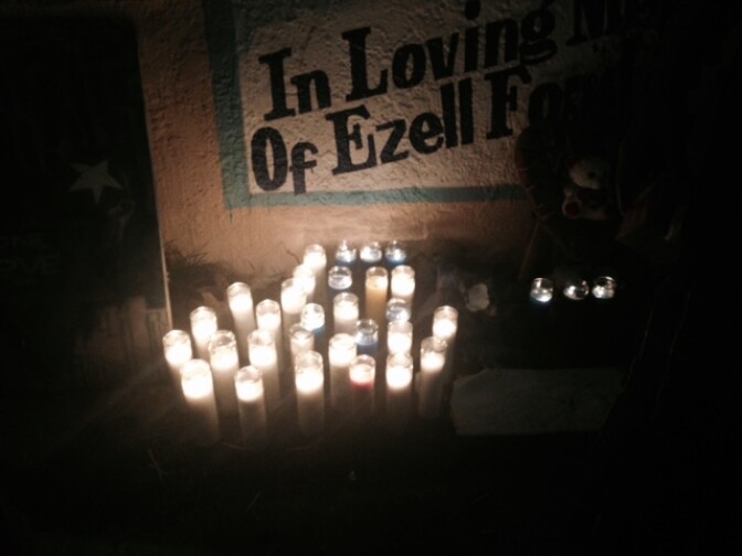 A few LA protesters gathered at a makeshift memorial at 65th and Broadway for Ezell Ford Monday night after the autopsy report was released. 